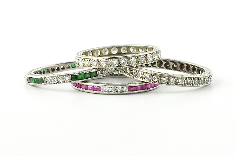 The author's collection of channel-set eternity bands, below, includes modern and antique rings mixed with round diamonds, square cut emeralds, and square cut rubies.