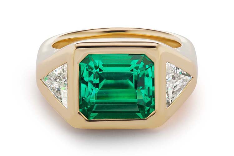 Emerald-cut diamond ring with two triangle diamond sides in 18K yellow gold. (Photo by Brent Neale)