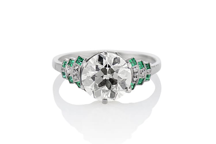The One I Love NYC Platinum and 1.82 Old European Cut Diamond ring with emeralds on the shoulders. (Photo courtesy of The One I Love NYC)