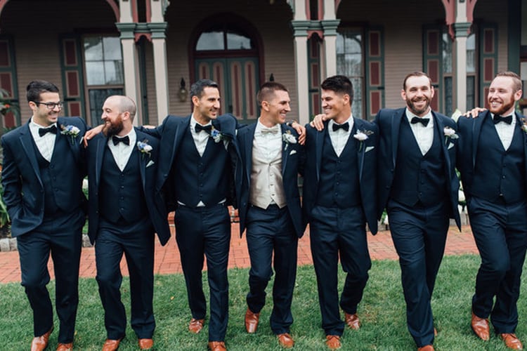 Groom and groomsmen in tuxedos