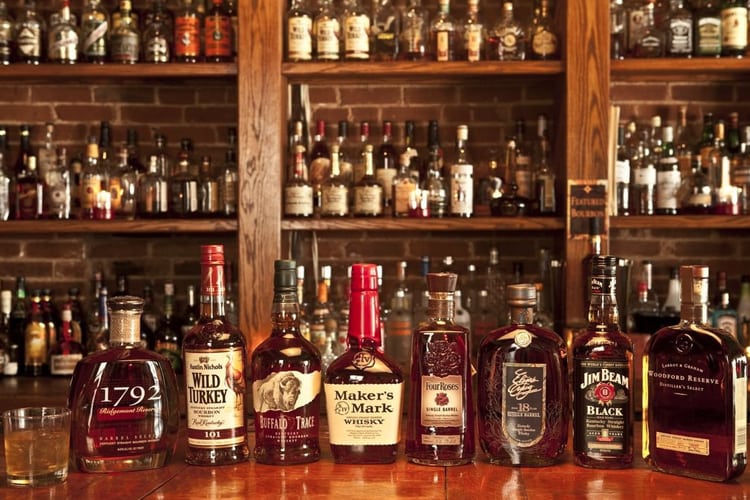 Bachelor Part Louisville - Whiskey bottles on a bar for the bourbon crawl