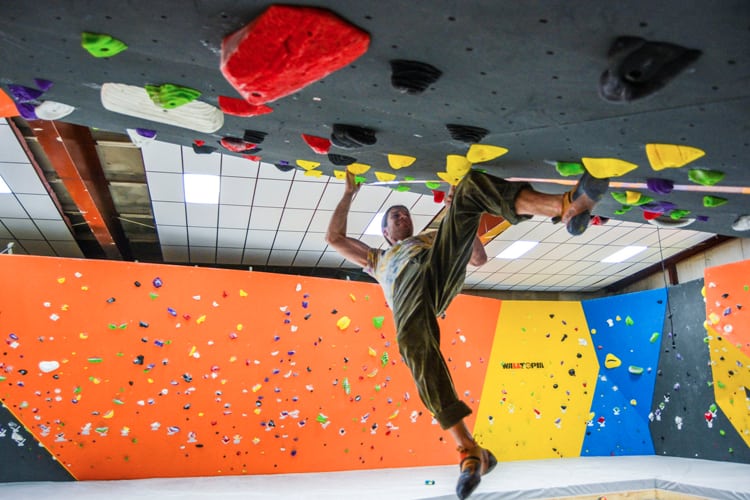 Bachelor Part Louisville - man ascending a rock climbing wall at Nulu