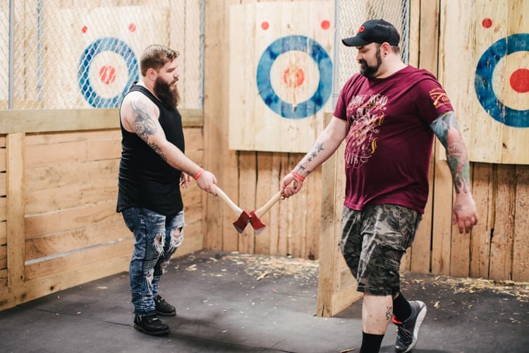 Bachelor Part Louisville - two dudes with bears at an axe-throwing range