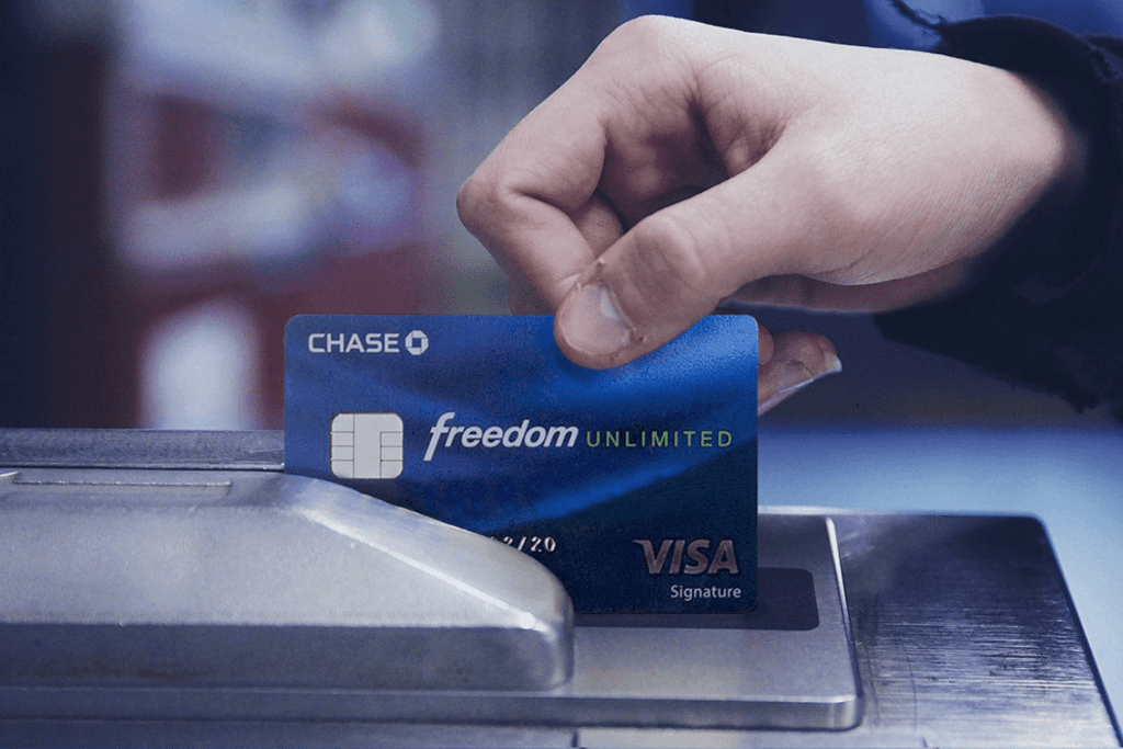 A chase Freedom Credit Card is put through a card scanner
